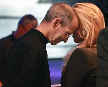 Steve Jobs rests his head against his wife, Laurene Powell Jobs, after delivering his last keynote address on June 6, 2011